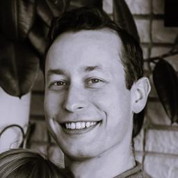 Grayscale profile picture of Tyler; he's not bad looking